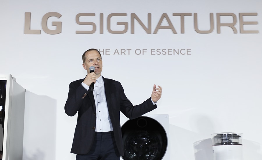 lg signature master designer torsten valeur is talking about lg signature on the main stage in front of all the lg signature products