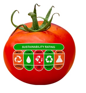 A tomato with a sustainability rating sticker.
