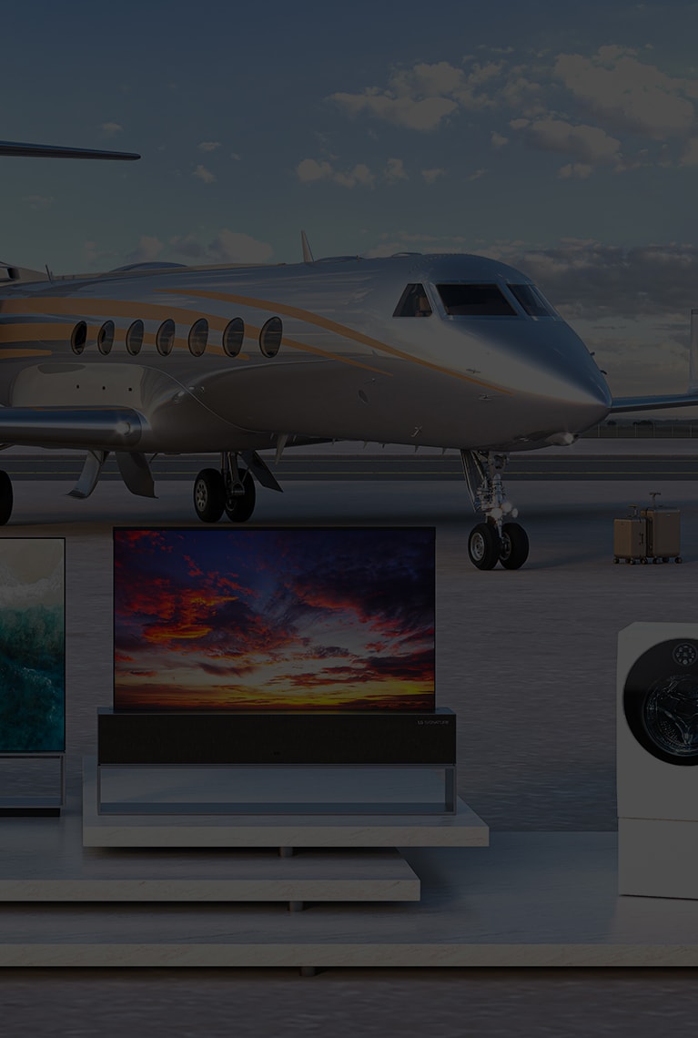 LG's signature wine cellar, OLED 8K TV, refrigerator, and washing machine are on display on a runway and an airplane is behind them