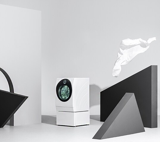 lg signature washing machine is displayed right in the middle of the picture with some triangle and arch structures around it