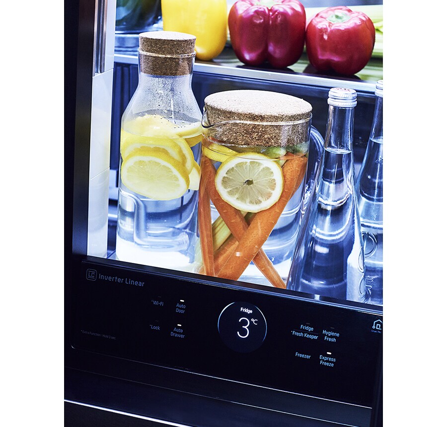 close shot of some drinks inside lg signature refrigerator with light on of the instaview