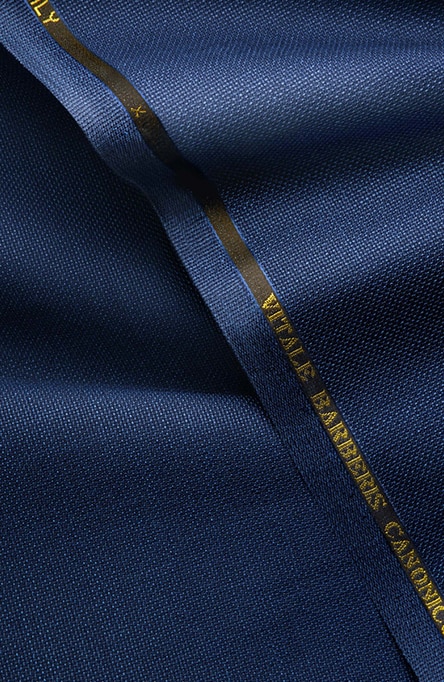 Blue fabric with a tag that reads 'Vitale Baberis Canonico.'