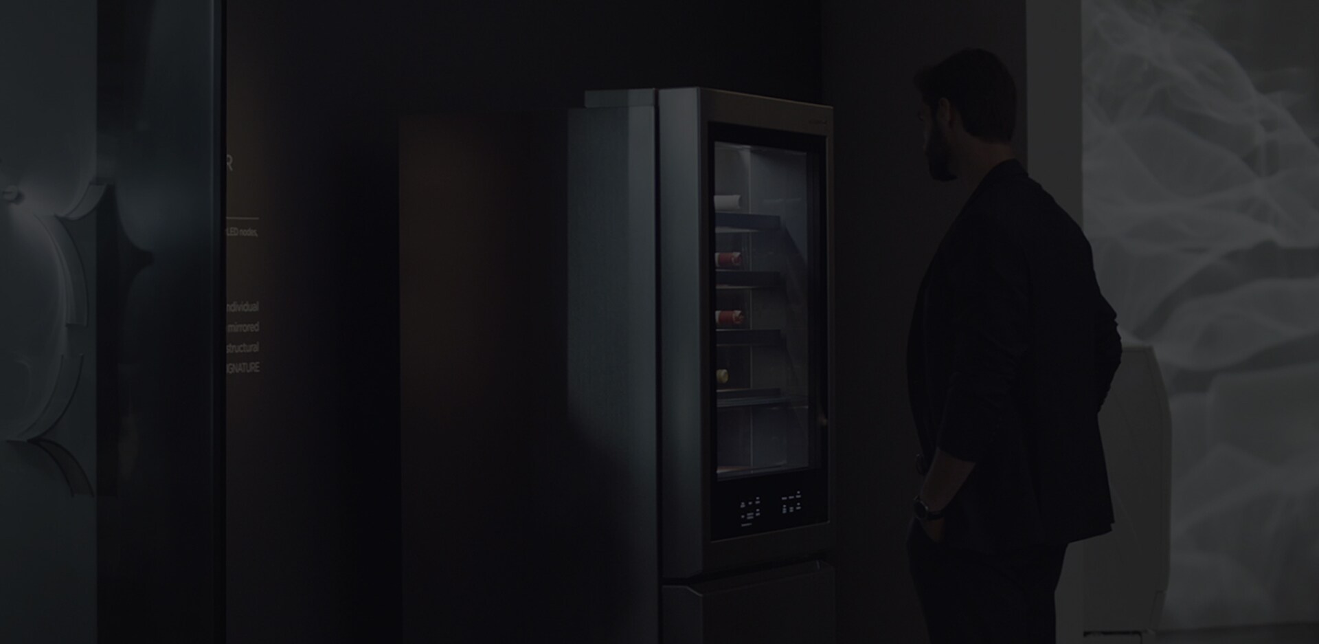 a man is looking at lg signature refrigerator at ifa 2018