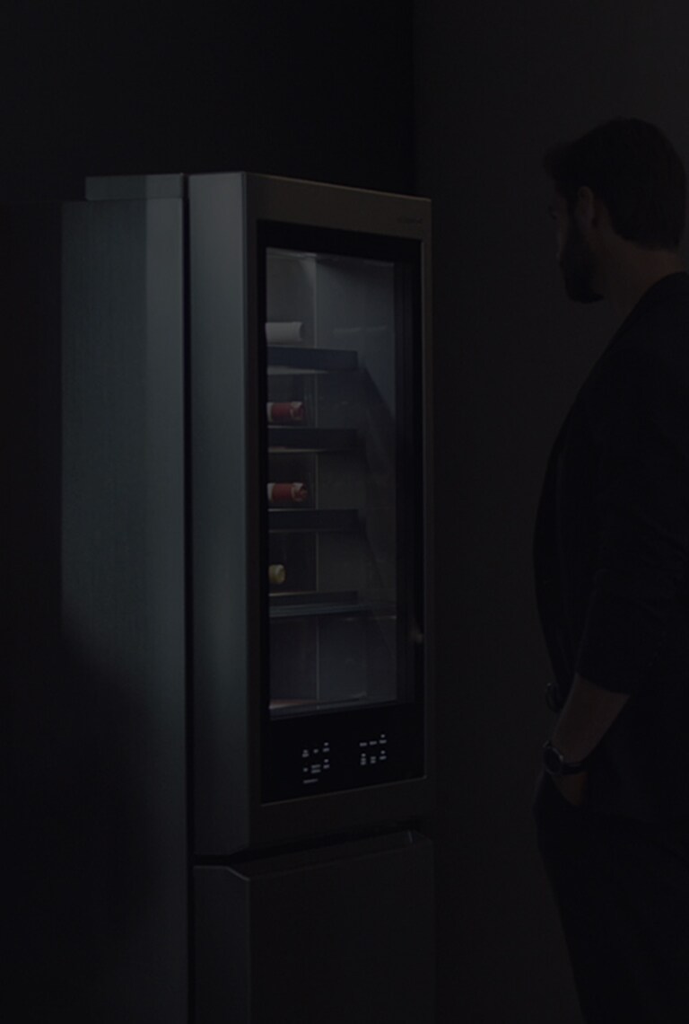 a man is looking at lg signature refrigerator at ifa 2018