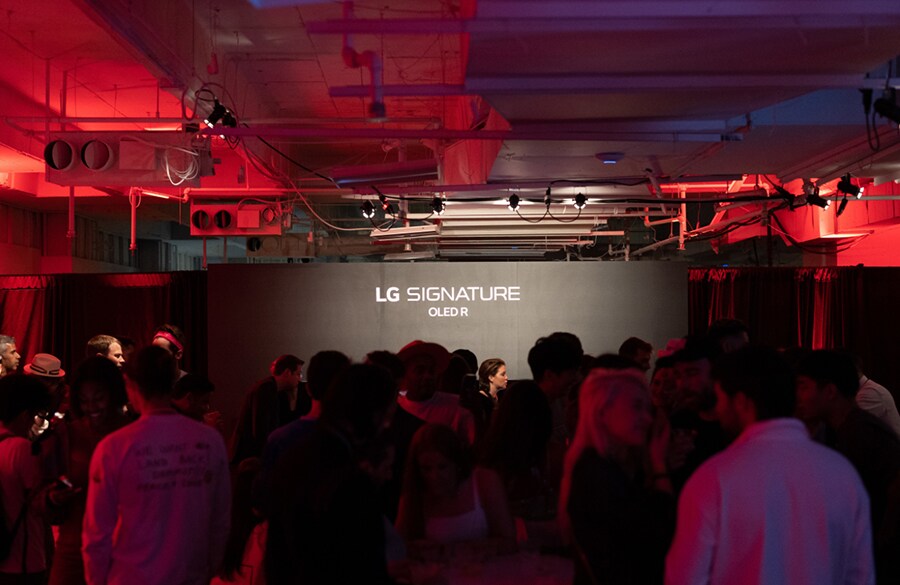 Partygoers enjoy the LG SIGNATURE lounge at The Gateway, an exclusive exhibition of NFT-based art and collectibles that was presented by nft now and Christie’s.