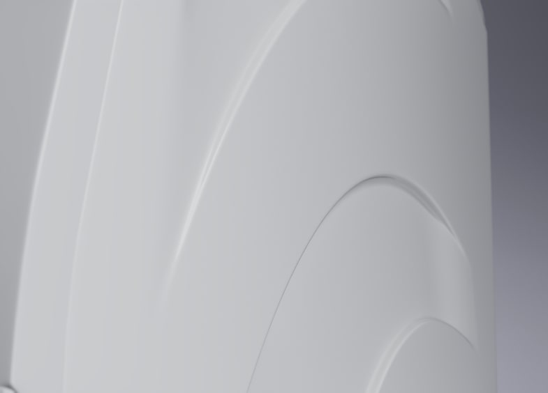 A close up image of the white enamel body of the LG Signature Washing Machine, showing the details in the material.