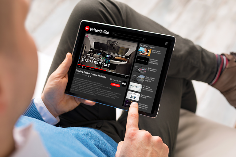 Man watching a video about LG VS' product and technology. 