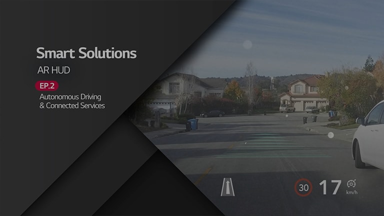 A photo of a road with a car on the right, showing smart solutions AR HUD.