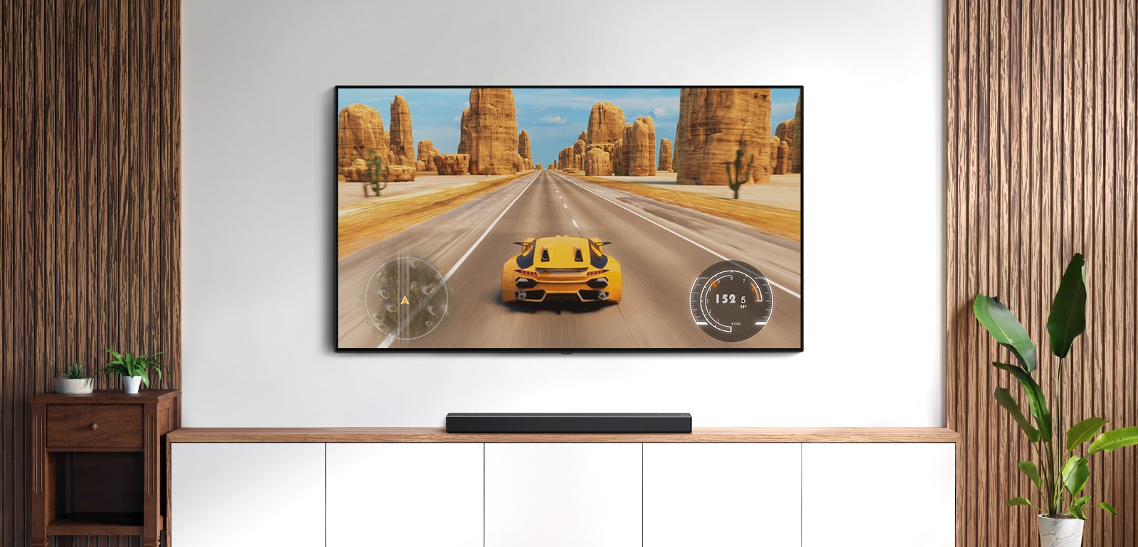 Υπάρχει μια τηλεόραση και ένα soundbar σε ένα σαλόνι. Ένα παιχνίδι αγώνων ταχύτητας σε μια οθόνη τηλεόρασης. (αναπαραγωγή βίντεο)