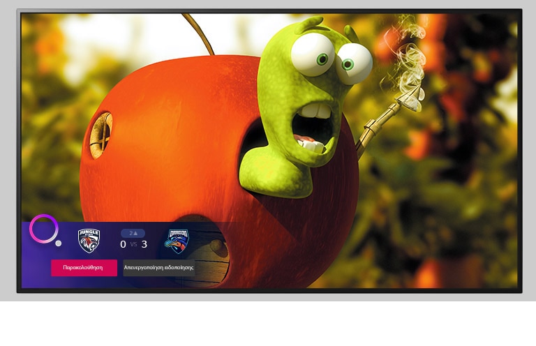 Μια τηλεόραση που παίζει κινούμενα σχέδια και μια ειδοποίηση για αθλητικά στο κάτω μέρος της οθόνης.