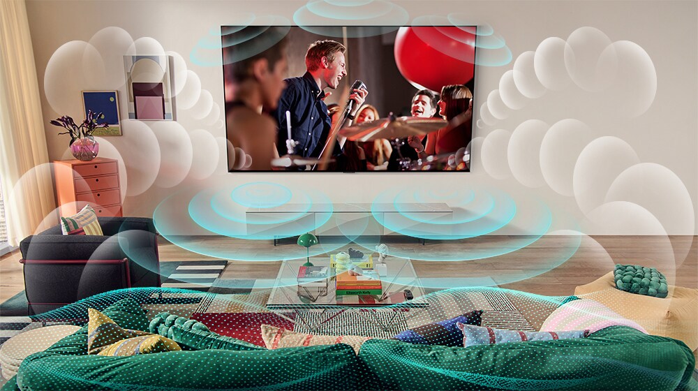 Η εικόνα μιας τηλεόρασης LG OLED σε ένα δωμάτιο όπου προβάλλεται μια συναυλία. Τον χώρο γεμίζουν φυσαλίδες που απεικονίζουν εικονικό ήχο surround.
