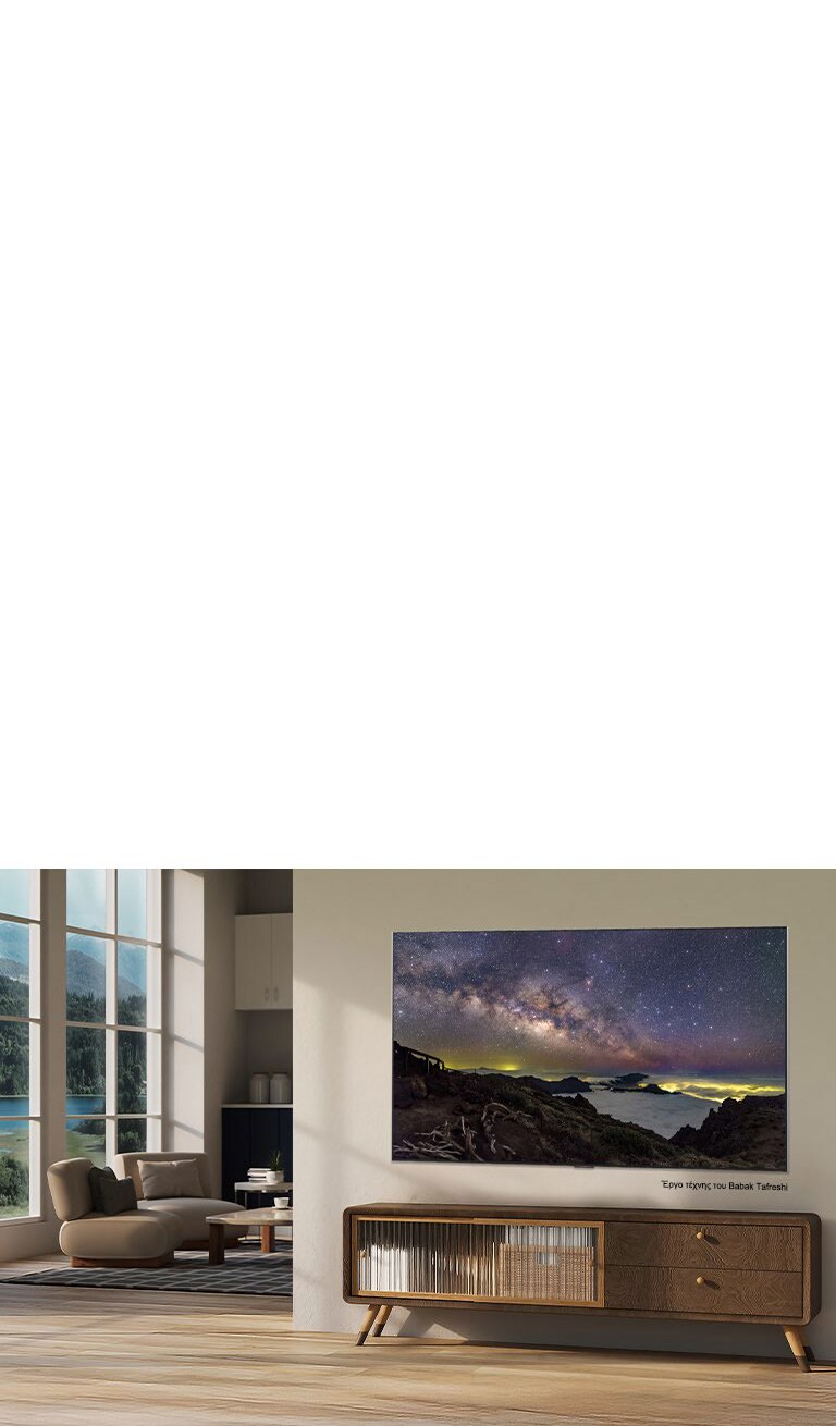 Η LG QNED evo AI Mini LED QNED8M με LG Gallery+, προσφέροντας ποικίλο καλλιτεχνικό περιεχόμενο, εμφανίζει ένα έργο τέχνης με τοπίο νυχτερινού ουρανού του Babak Tafreshi σε έναν μοντέρνο χώρο καθιστικού ως μέρος μιας επιμελημένης καλλιτεχνικής εμπειρίας εντός της διεπαφής της τηλεόρασης.