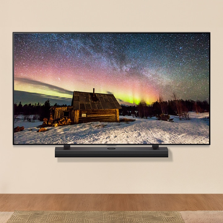 Μια LG TV και ένα LG Soundbar σε ένα σύγχρονο σαλόνι την ημέρα. Εμφανίζεται μια εικόνα της οθόνης του Βόρειου Σέλας με τα ιδανικά επίπεδα φωτεινότητας.