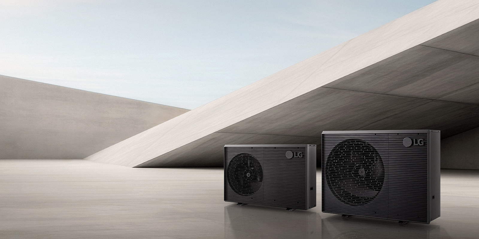 A image showing two LG Therma V R290 Monobloc S outdoor heat pump units in a minimalist concrete interior.