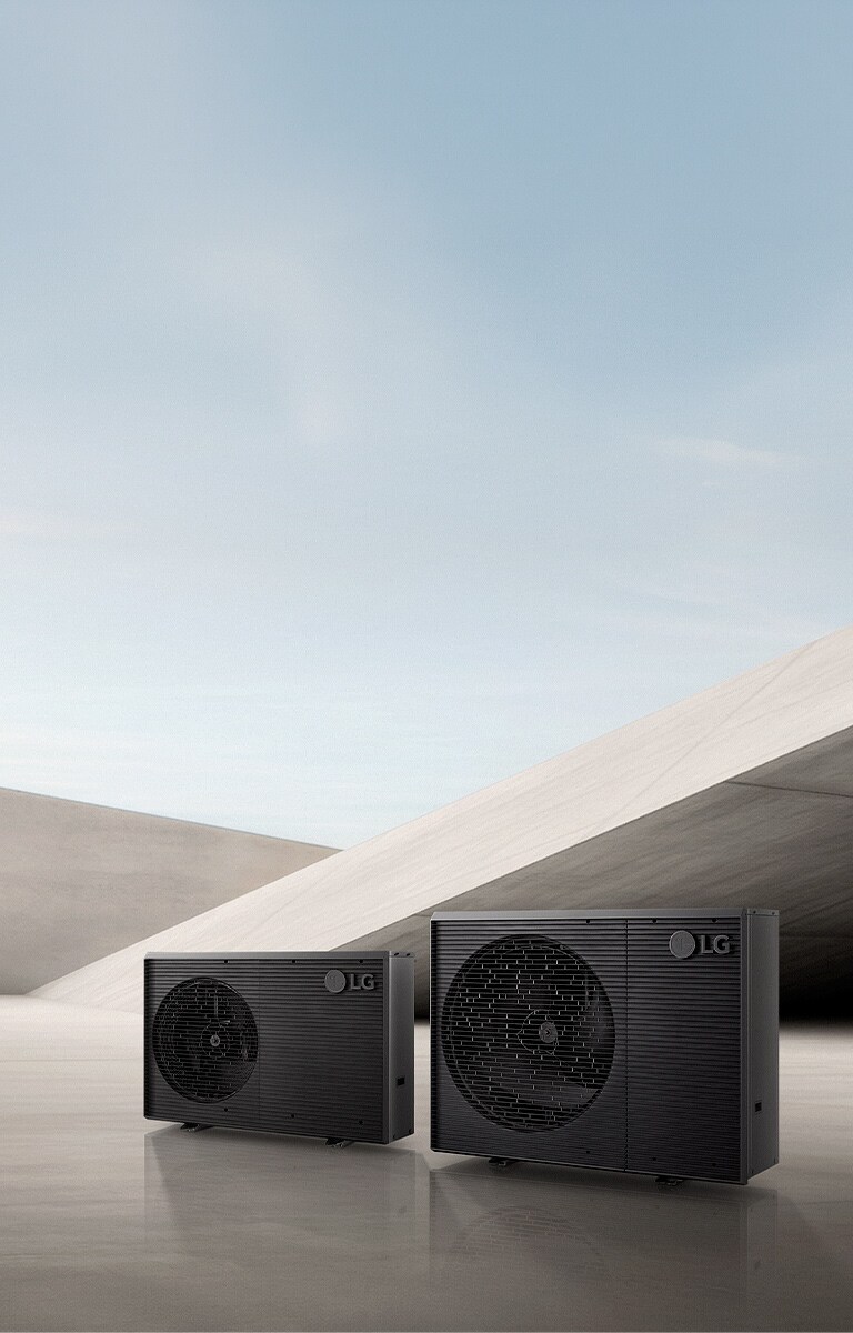 A image showing two LG Therma V R290 Monobloc S outdoor heat pump units in a minimalist concrete interior.