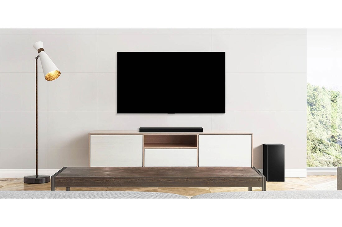 LG Soundbar SPD7Y, Μια τηλεόραση, ένα soundbar και ένα subwoofer τοποθετημένα σε ένα λιτό σαλόνι, SPD7Y