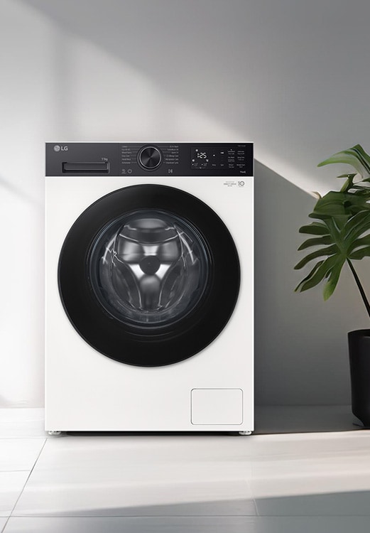 Πλυντήριο ρούχων εμπρόσθιας φόρτωσης τοποθετημένο σε ένα σύγχρονο πλυσταριό