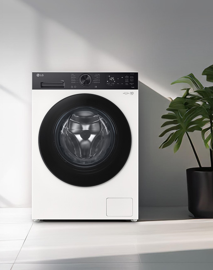 Πλυντήριο ρούχων εμπρόσθιας φόρτωσης τοποθετημένο σε ένα σύγχρονο πλυσταριό