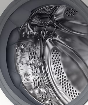 Κοντινό πλάνο του κάδου του πλυντηρίου ρούχων με την πόρτα ανοικτή