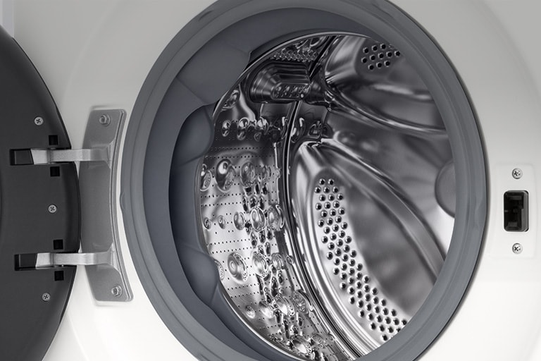 Κοντινό πλάνο του κάδου του πλυντηρίου ρούχων με την πόρτα ανοικτή