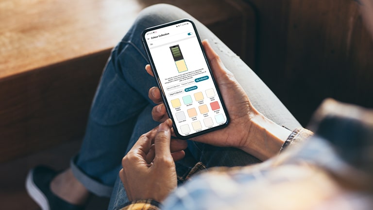 Image showing an app that allows you to manipulate the refrigerator into phone holding in hand.