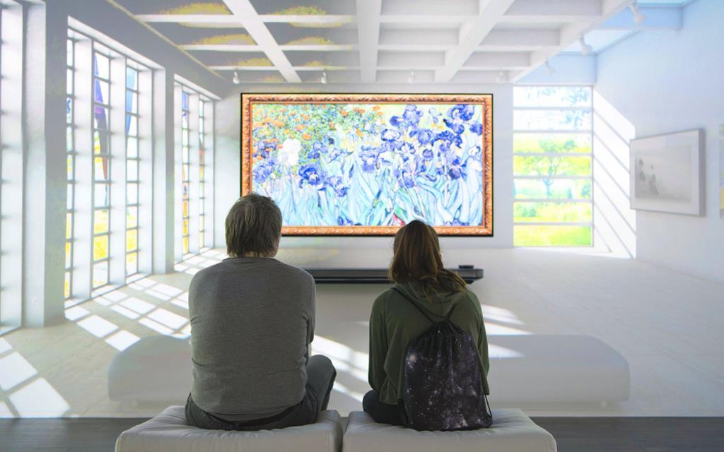 Two people who see a LG OLED TV in IFA 2017.