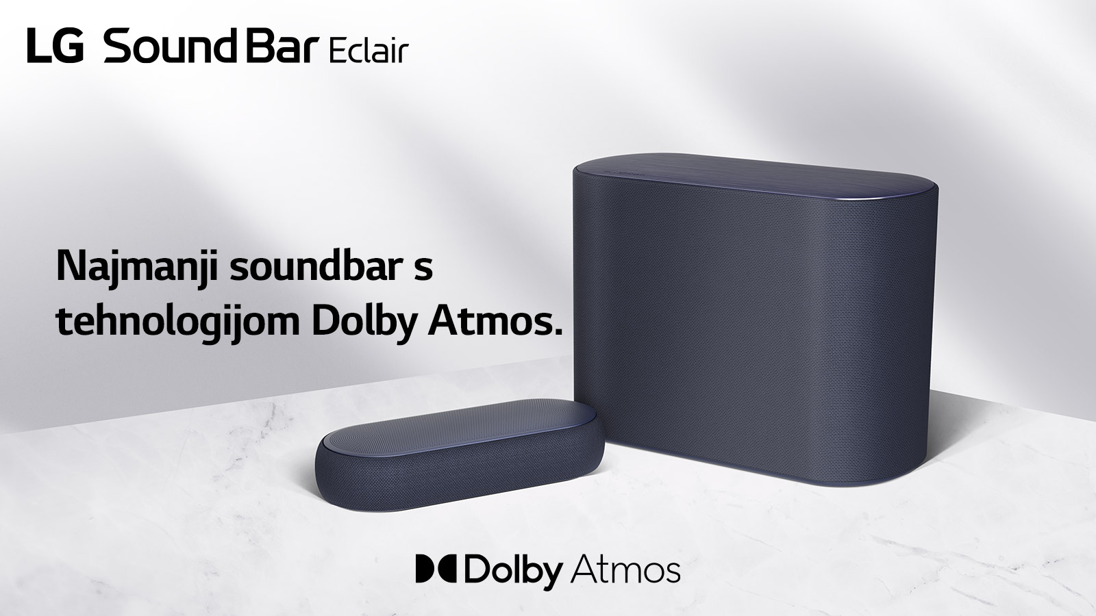 Soundbar i niskofrekvencijski zvučnik nalaze se na mramornom podu okrenuti prema suprotnim stranama