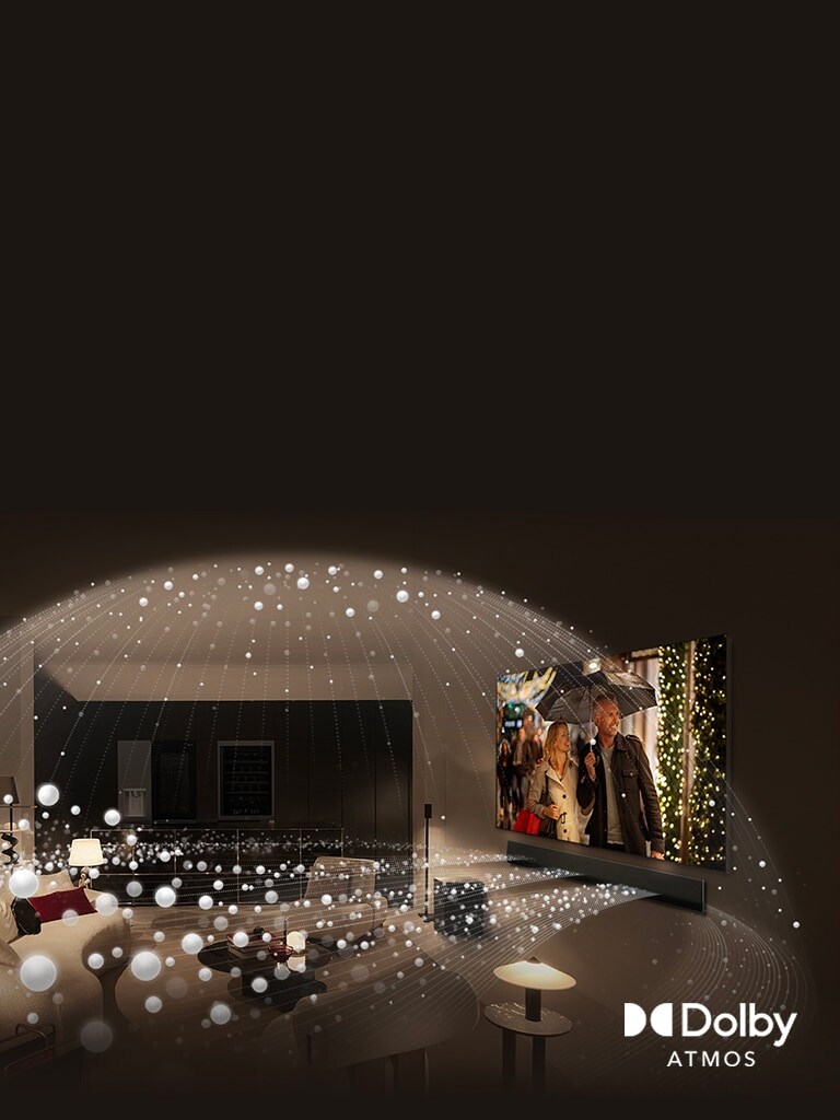 Ultra veliki LG televizor montiran na zidu ispunjava cijeli zid u udobnom dnevnom boravku, a bijele kuglice svjetla izviru iz televizora i padaju po sobi.