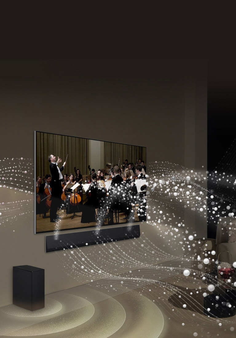  LG Soundbar,  LG TV i niskofrekventni zvučnik (subwoofer) u dnevnom boravku s kojih se reproducira nastup klasične glazbe. Bijele kapljice stvaraju zvučne valove koji se kreću prema gore i naprijed iz soundbara i prikazuju se na televizoru. Niskofrekventni zvučnik (subwoofer) stvara zvučni efekt odozdo.