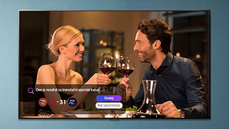 A man and a woman toast with glasses on the TV screen while notifications of sports reminders arrive