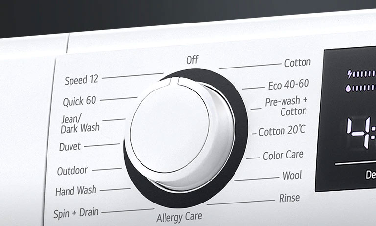 Prikaz gumba za odabir programa perilice rublja izbliza.