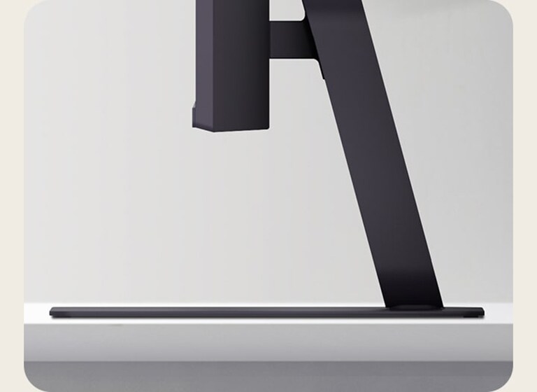 Bočni prikaz stalka za monitor LG UltraGear na stolu.	