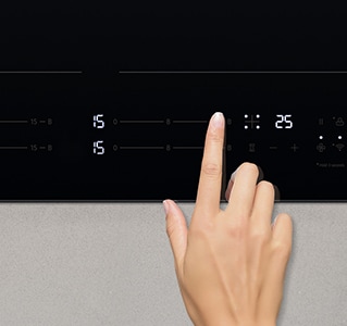 Ova slika dodiruje upravljačku ploču indukcijske ploče za kuhanje.