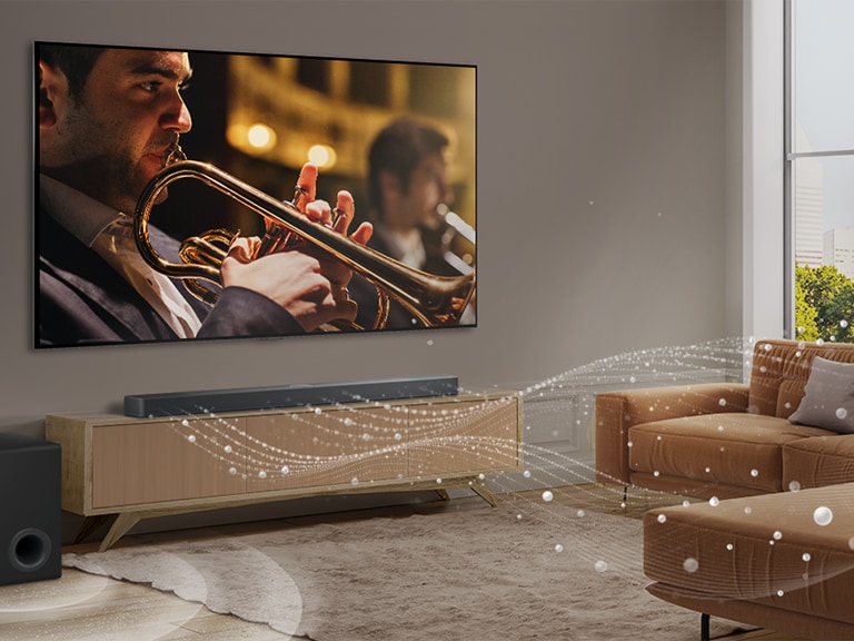  טלוויזיה של LG, ‏LG Soundbar וסאב-וופר בדירה עירונית מודרנית. LG Soundbar מפיק גלי קול עשויים טיפות לבנות שממלאים את החדר, וסאב וופר יוצר אפקט קולי מלמטה. יחד, הם יוצרים אפקט של כיפה בחלל החדר.