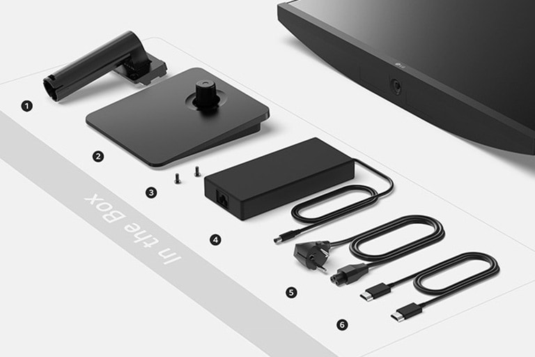 גוף המעמד, בסיס המעמד, ברגים, מתאם מתח, כבל מתח וכבל HDMI בקופסה.