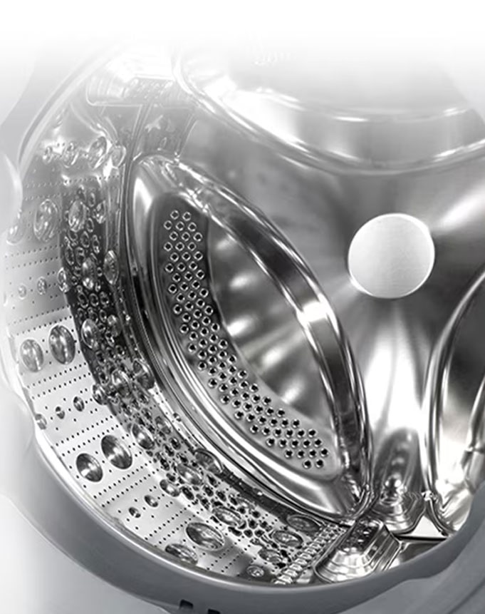 תמונה פנימית של מכונת הכביסה, שבה ניתן לראות מרים עשוי פלדת אל חלד.