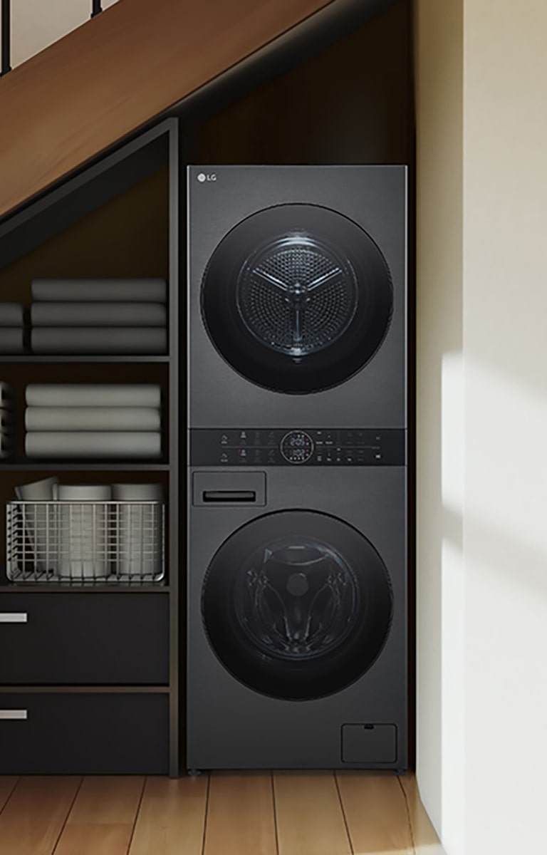 זהו קיר בחדר שנראה כמו חדר שירות. מכונת כביסה ומייבש LG WashTowern מסודר בהרמוניה עם הריהוט  אחרים בחדר.