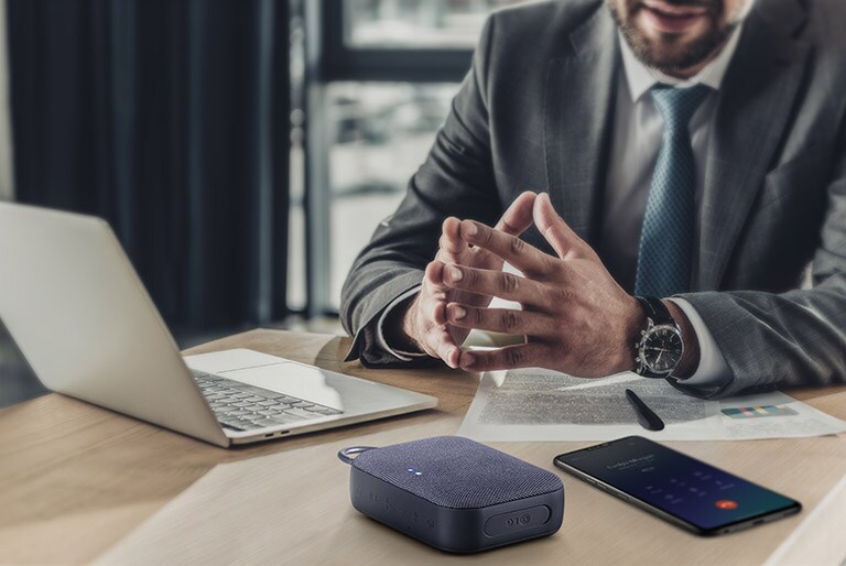 Two PN1 each placed on the left and right, slightly facing each other. There is a logo of two circles twisted within a big rainbow outlined circle ring placed between two PN1 products.