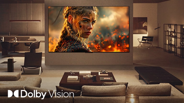 סלון עם טלוויזיית LG TV תלויה על הקיר. בטלוויזיה יש סרט, הצבעים, הבהירות והניגודיות מדהימים. גם הלוגו של דולבי ויז'ן נראה לעין. 