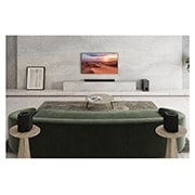 LG ساندبار S95QR با 9.1.5 کانال <br> توان خروجی 810 وات, A subwoofer, a sound bar, and TV are in a white living room, S95QR, thumbnail 5
