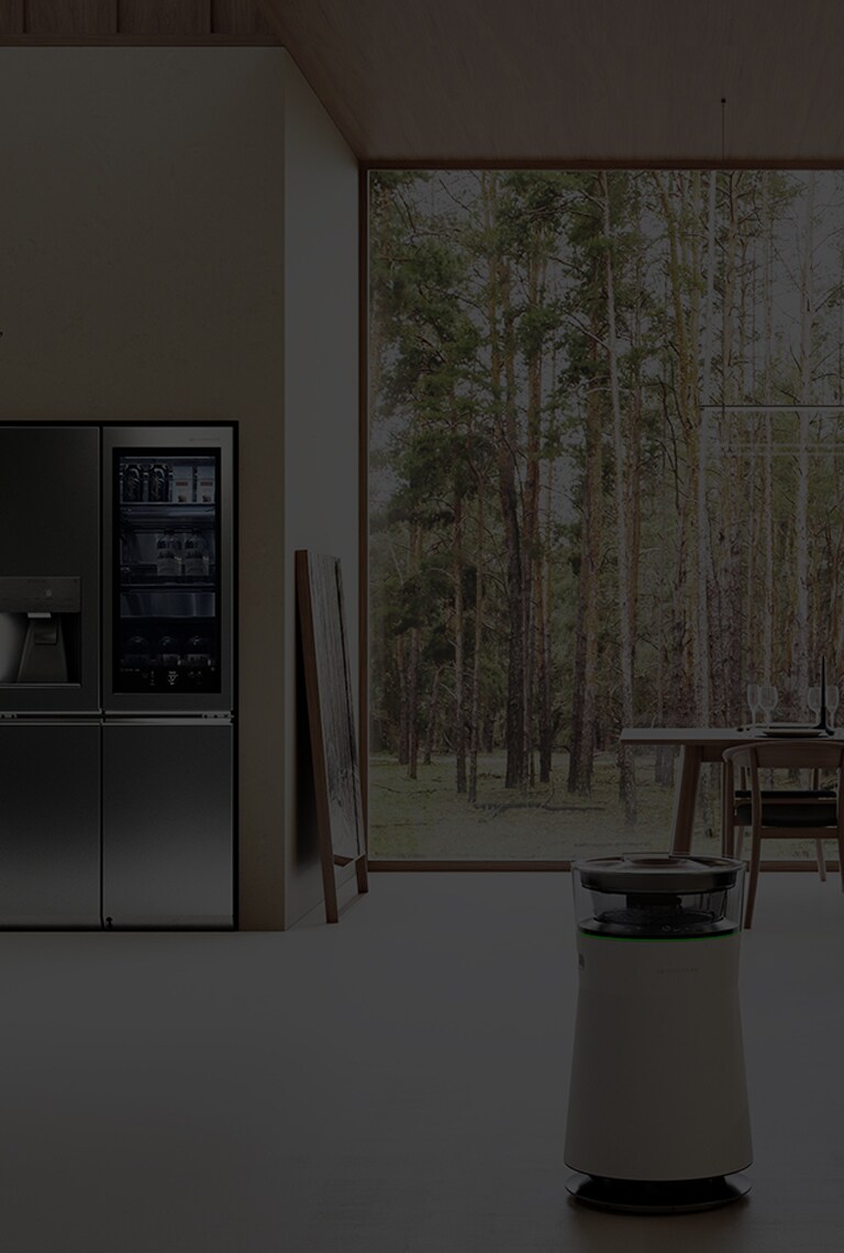 Il frigo e la cantina LG SIGNATURE fanno parte della cucina naturale, armonizzandosi con il tavolo Bull B&B Italia.