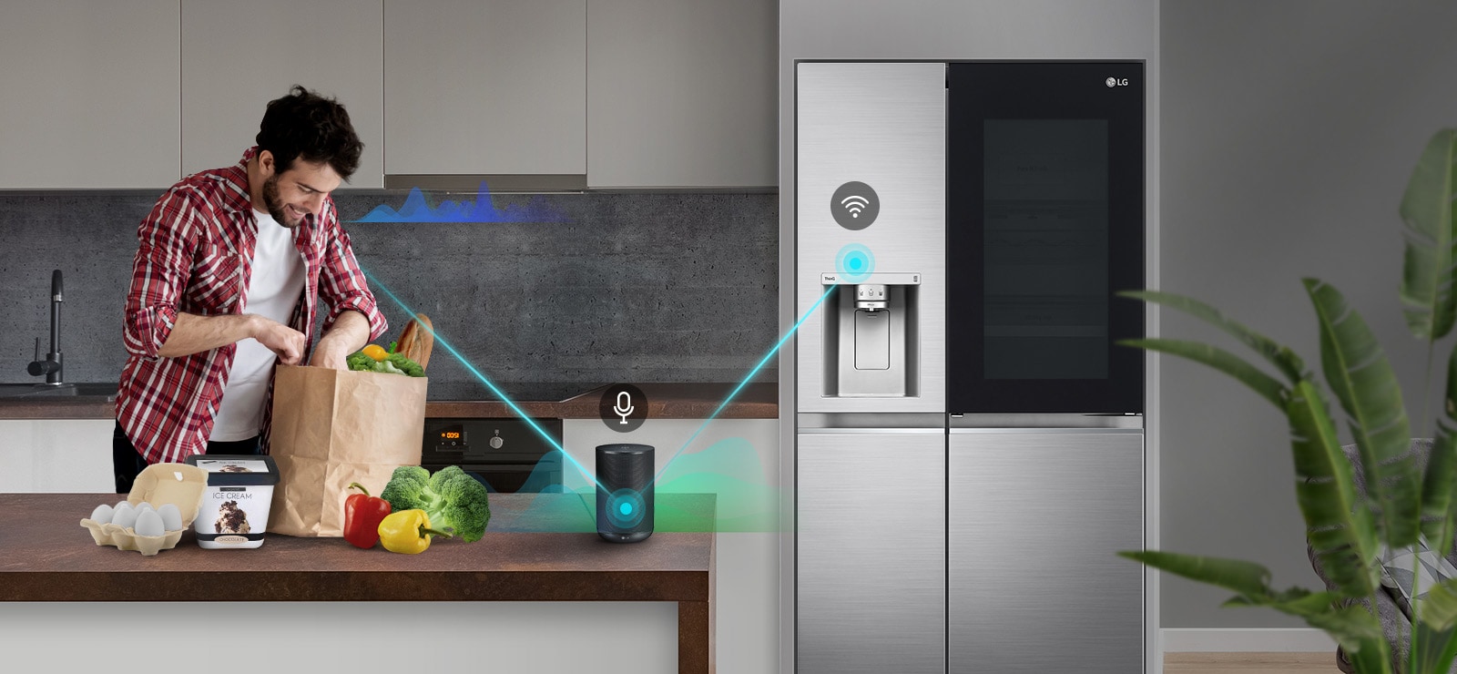 رجل يقف في المطبخ يفرغ منتجات من كيس بقالة ويتحدث.