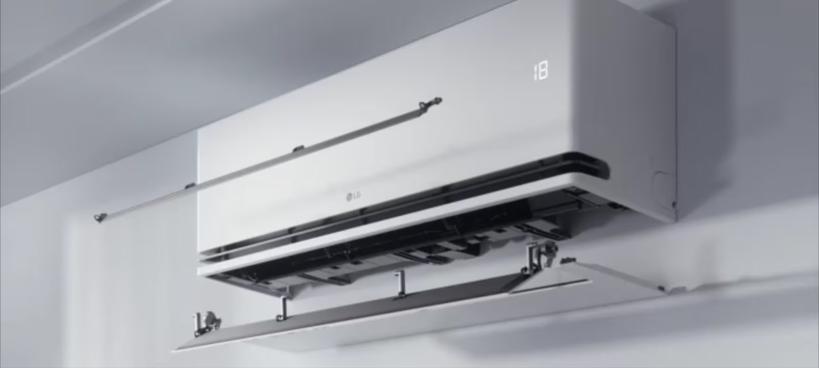 LG air conditioner with dual vane technology directing airflow for enhanced cooling and heating efficiency.