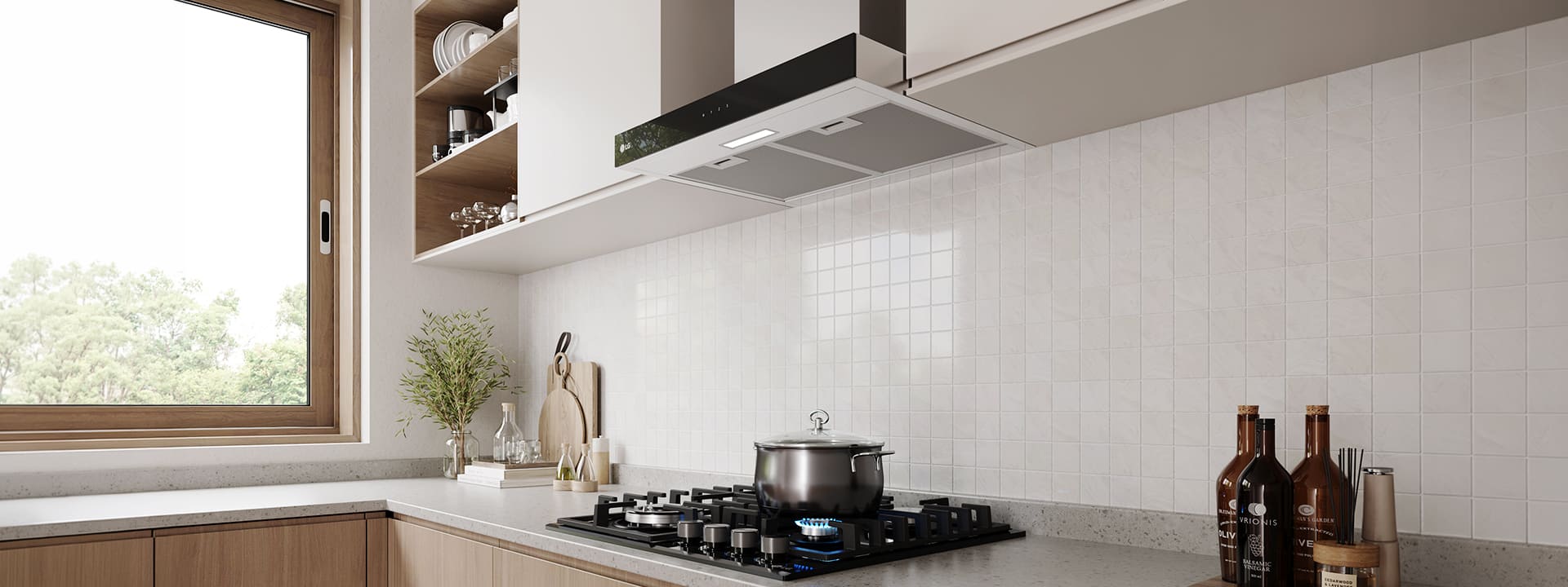 Modern kitchen interior featuring a built-in range hood above a gas cooktop with a pot, against a white tile wall.