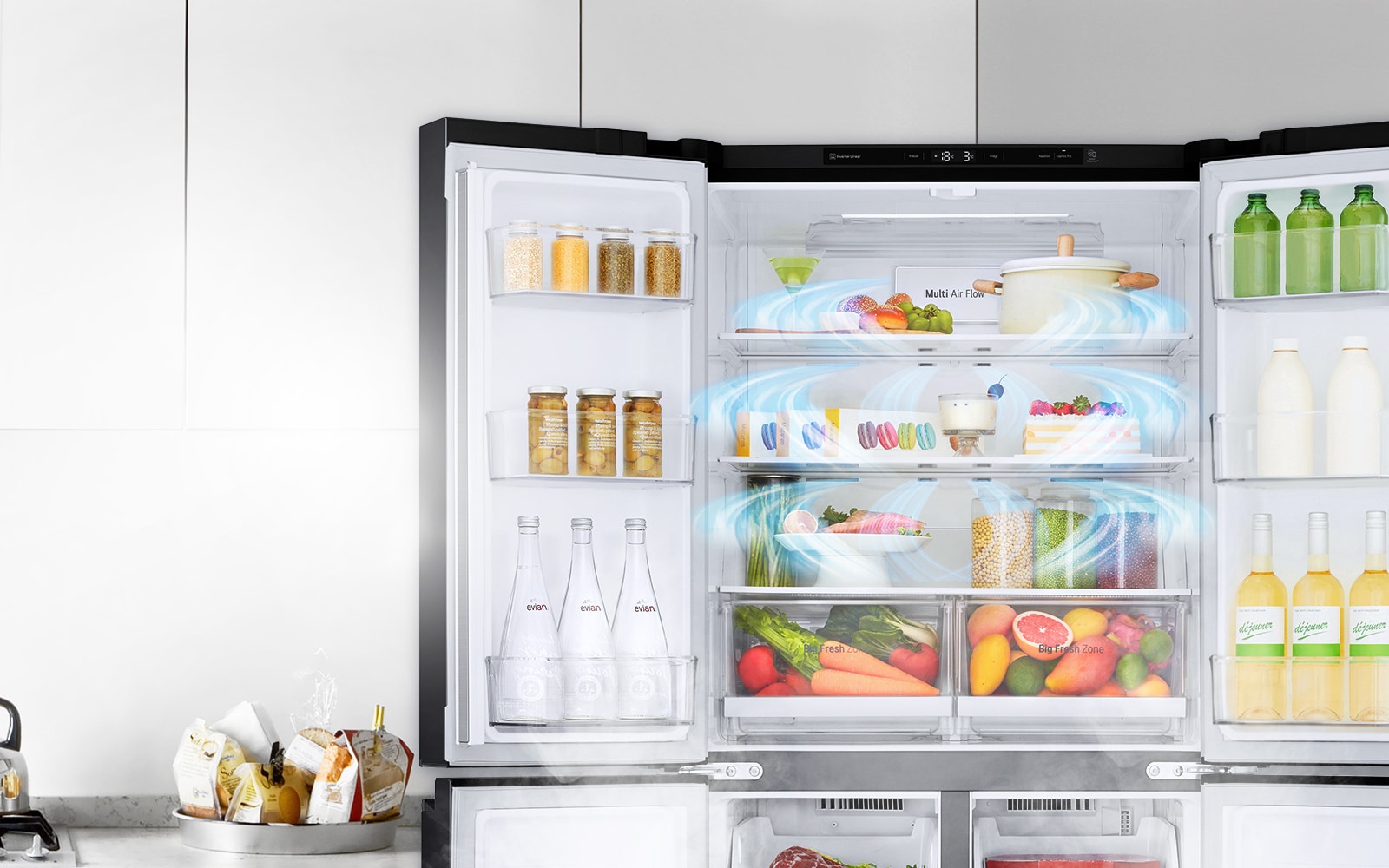 The top half of the refrigerator is shown with the door open and produce inside.