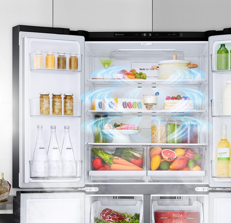 The top half of the refrigerator is shown with the door open and produce inside. 