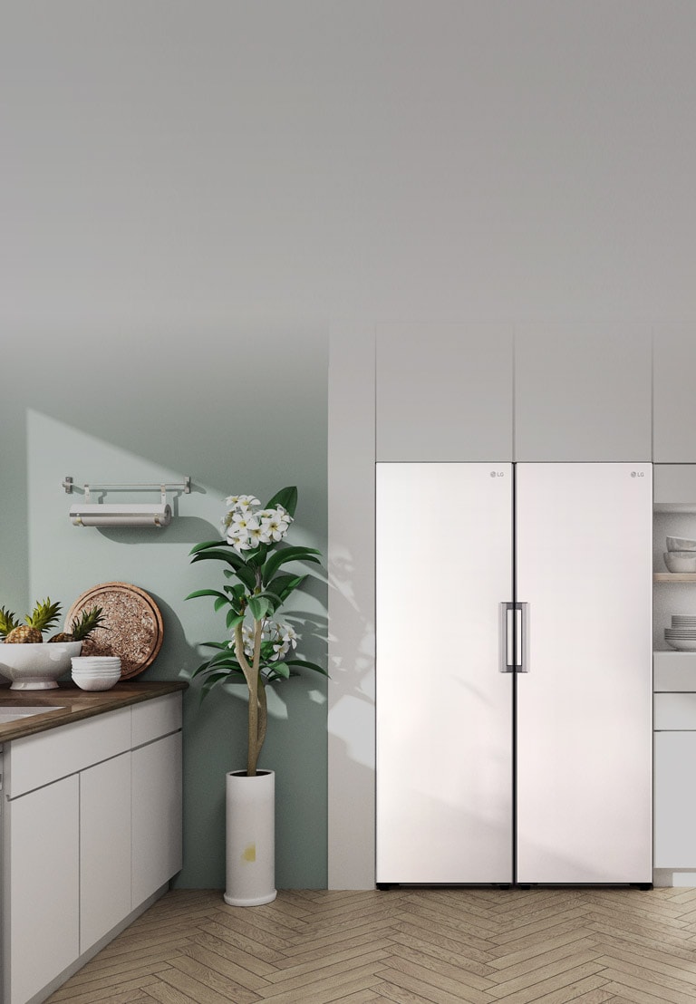 The front view of the refrigerator and freezer or shown fitting in seamlessly in a modern kitchen.