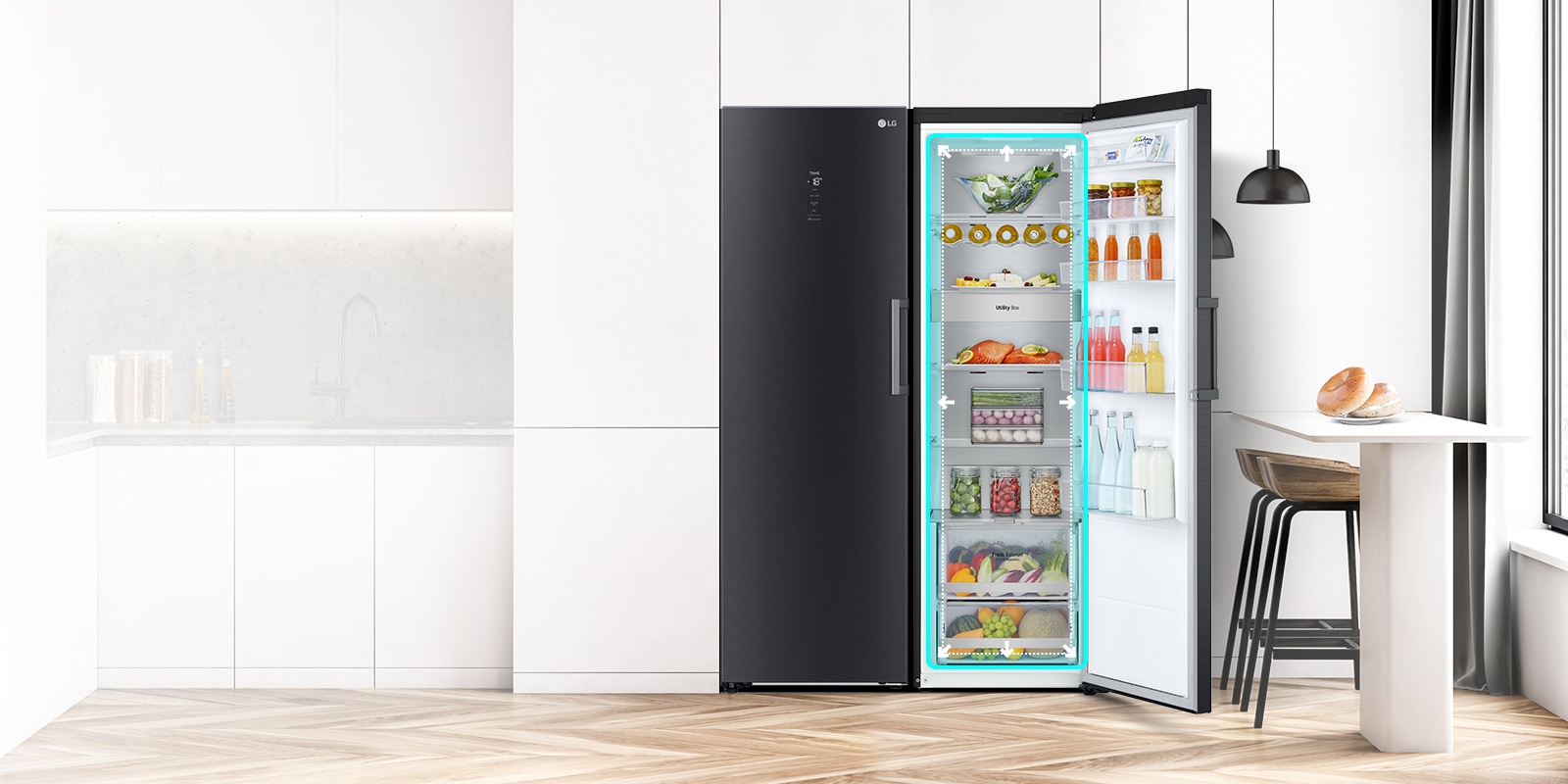The front view of the fridge is shown in a kitchen with the door open and displaying the produce inside. A blue square highlights the interior with arrows pushing out to indicate there is ample room inside.