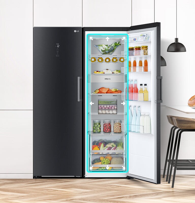 The front view of the fridge is shown in a kitchen with the door open and displaying the produce inside. A blue square highlights the interior with arrows pushing out to indicate there is ample room inside.