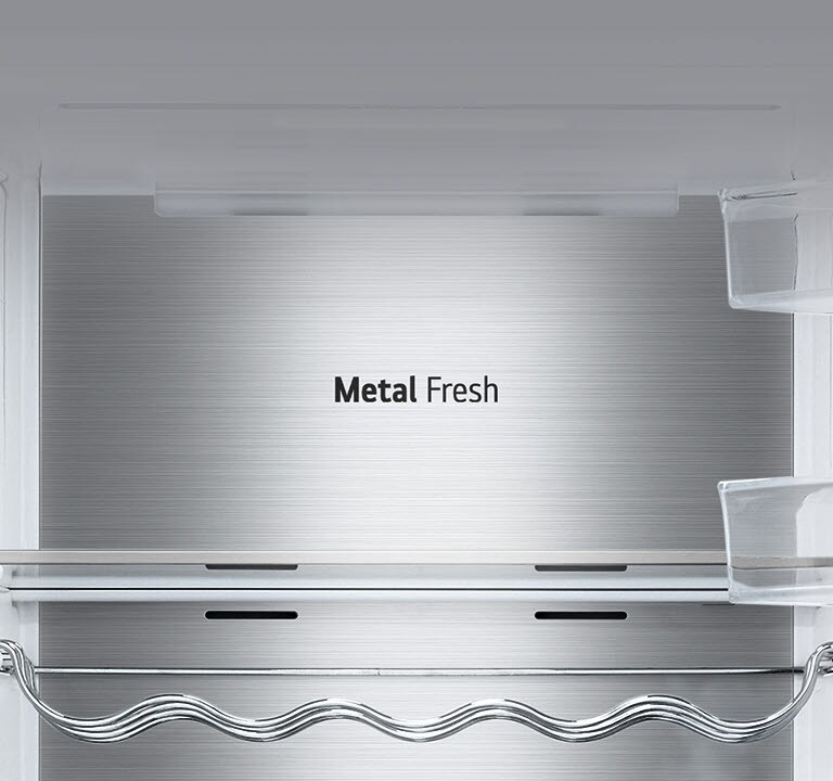 The interior of the fridge is shown empty with the wine rack and shelf in place and the back which is labeled "Metal Fresh".